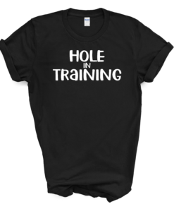 A black shirt that says hole in training.