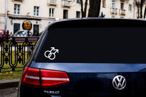 A car with a sticker of two male symbols on it.