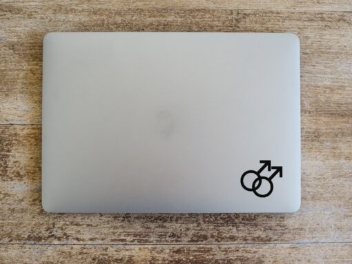 A laptop with two male symbols on the top of it.
