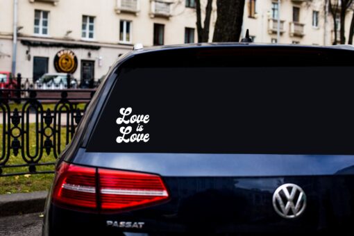 A car with the words love is love on it.