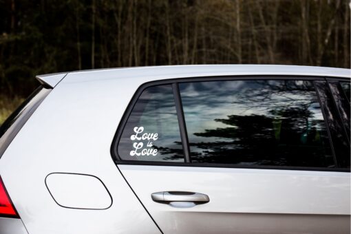 A car with the words " love is love " on it.