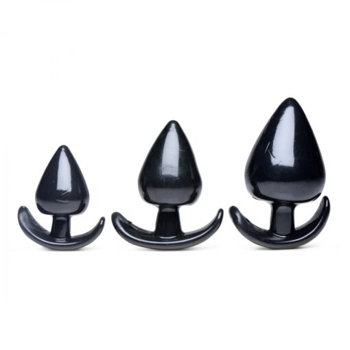 Three different sizes of black plastic anal plug.